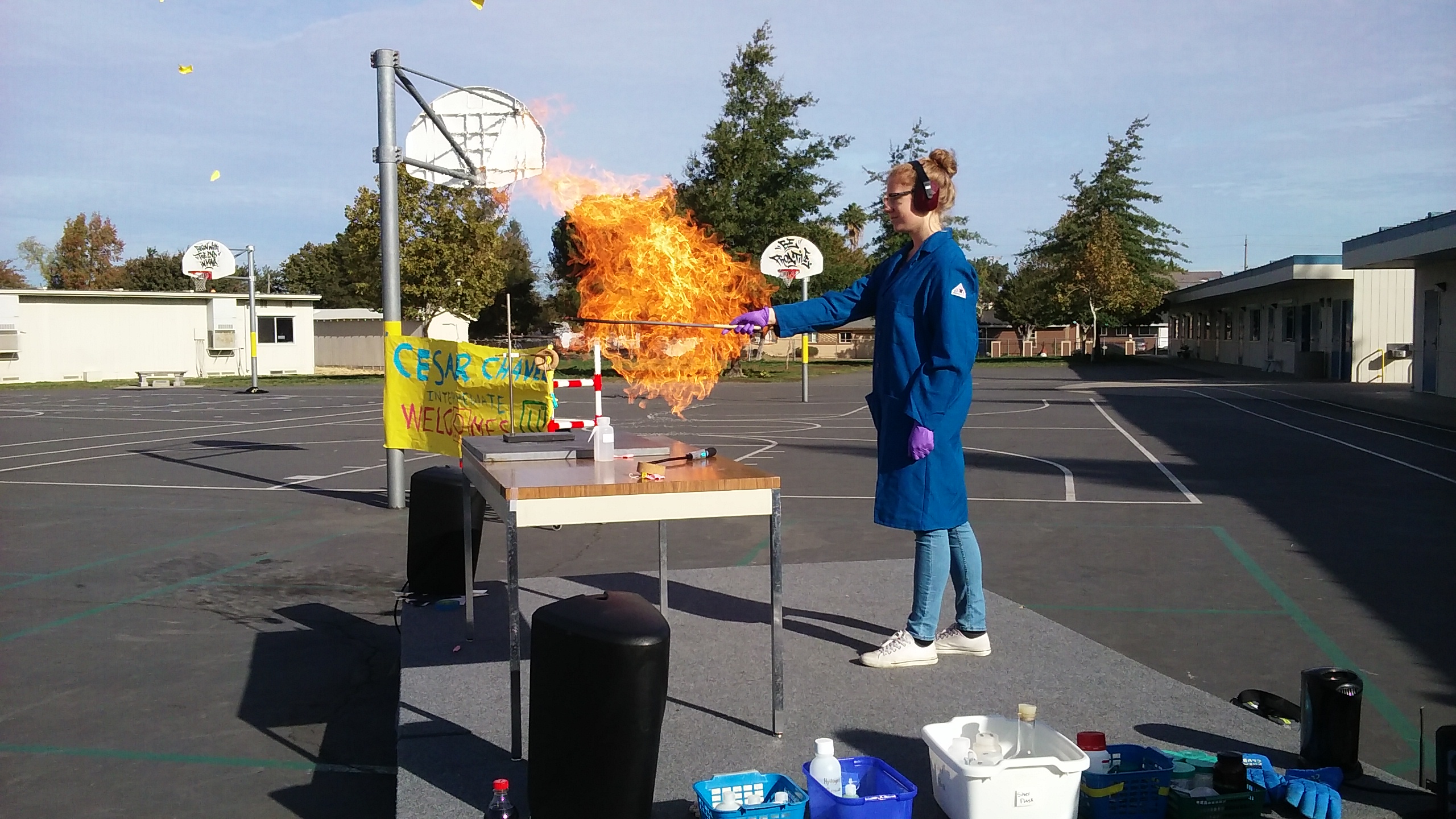 Graduate student Sommer Johansen demonstrates propane combustion at Cesar Chavez Elementary School in Sacramento, CA