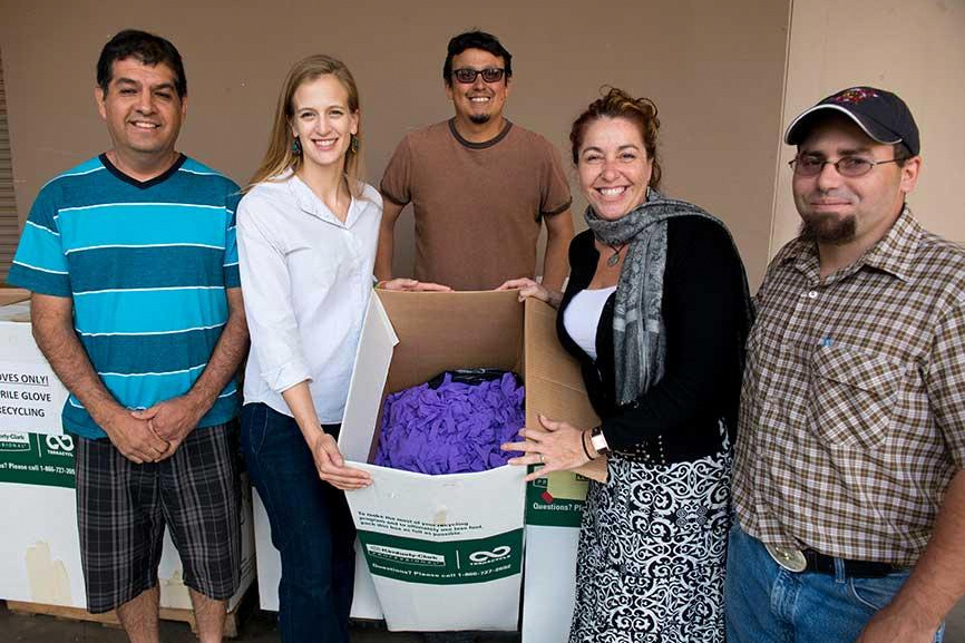 Lisa Anderson (holding the box on the left) first introduced a glove recycling program to the department in summer 2013. Lisa received her Ph.D. in Chemistry in 2015 under the direction of Professor Annaliese Franz.