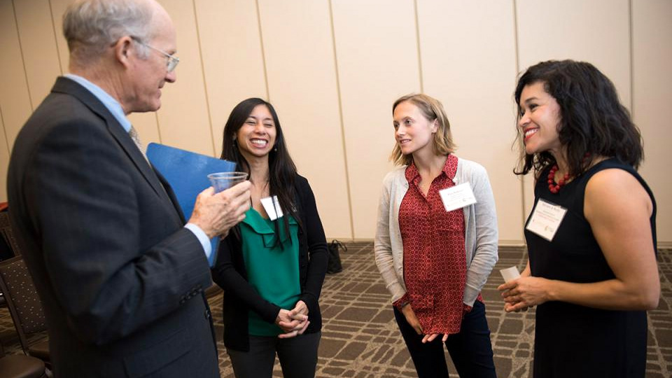 Ken Burtis, faculty advisor to the chancellor and provost, welcomes new CAMPOS faculty scholars Marie Cuevas Heffern, Kara Rudolph and Miriam A. Nuño.