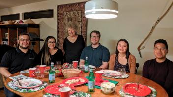 Marilyn, Alan and students at a group potluck in 2019