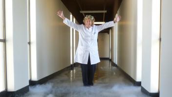 A joyful photo of Marilyn in the Chemistry Annex hallway, 2012