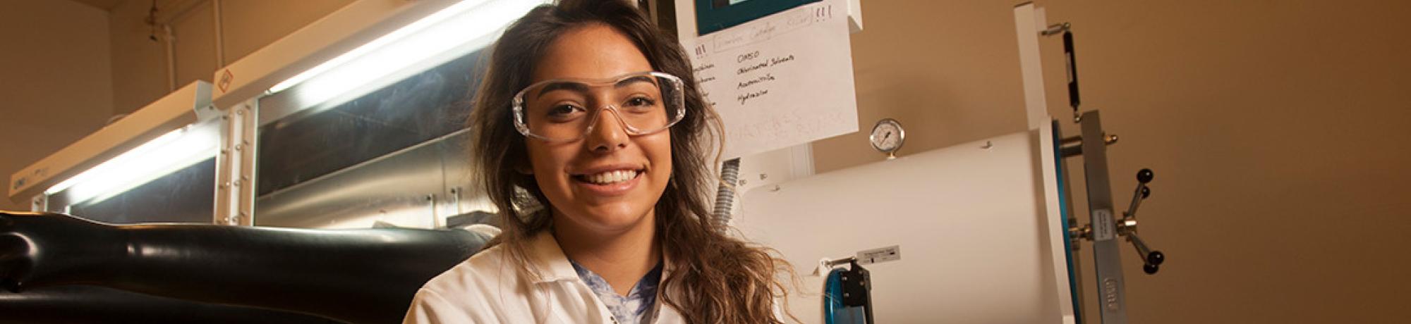 Kaia Yellowhorse, a Native American student from Yreka in Northern California, works in a lab creating nanoparticles for her pharmaceutical chemistry major. She wants to be a professor and run her own lab one day. (Gregory Urquiaga/UC Davis)